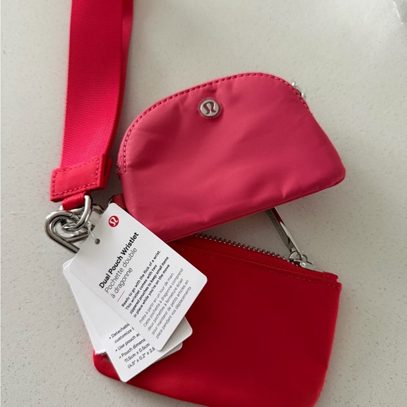 lululemon athletica Handbags - lululemon athletica Dual Pouch Wristlet in Bright Pink and Red